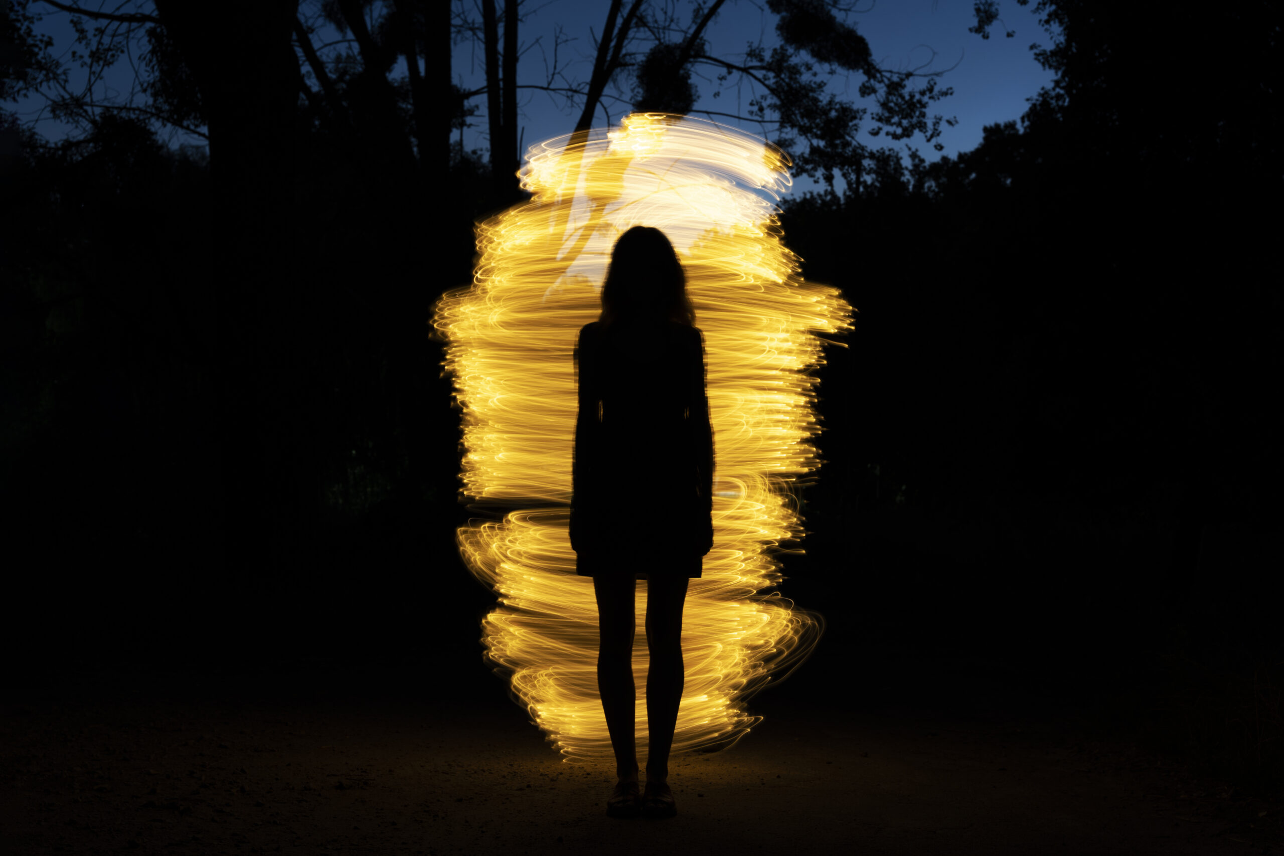 Woman surrounded by a bright light.